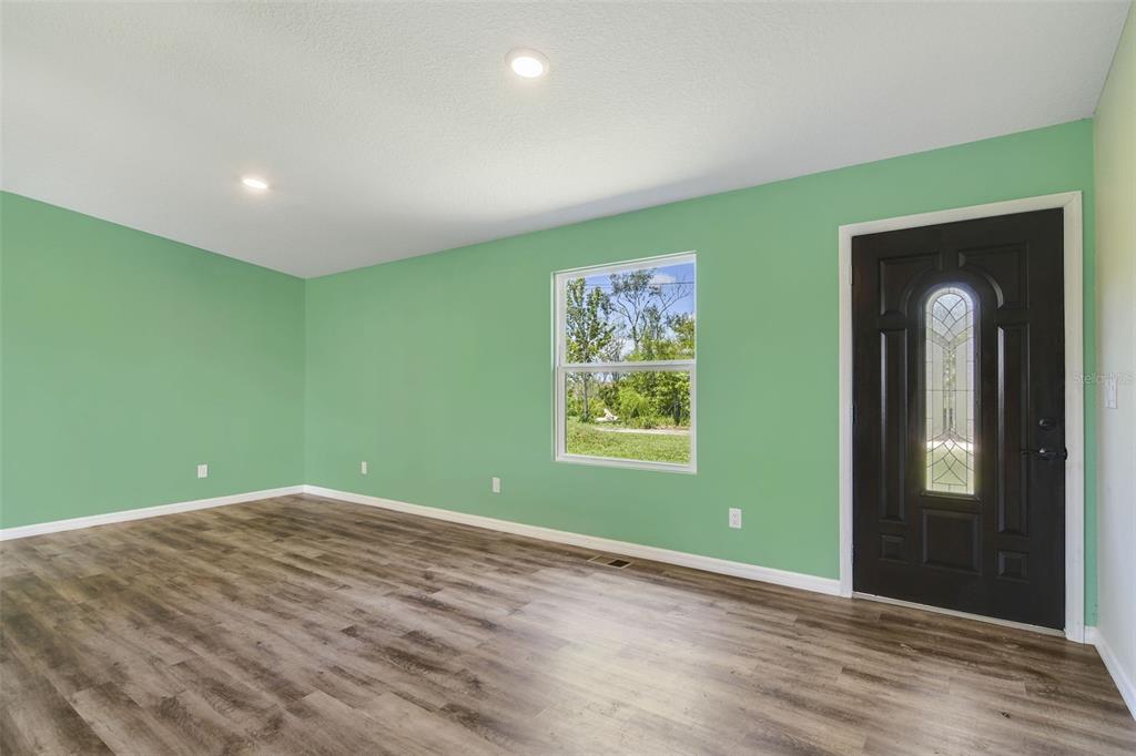 3380 Maple Lane Haines City, FL 33844 - Photo 15 of 28 an empty room with window and stairs