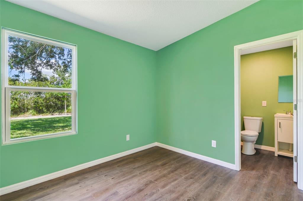 3380 Maple Lane Haines City, FL 33844 - Photo 17 of 28 a room with a window and a wooden floor
