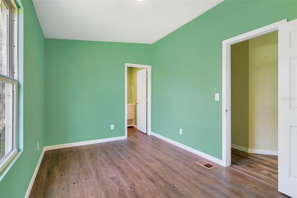 3380 Maple Lane Haines City, FL 33844 - Photo 18 of 28 a view of empty room with wooden floor