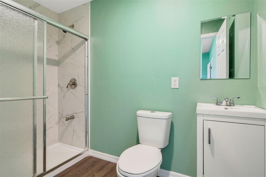 3380 Maple Lane Haines City, FL 33844 - Photo 20 of 28 a bathroom with a toilet sink and shower