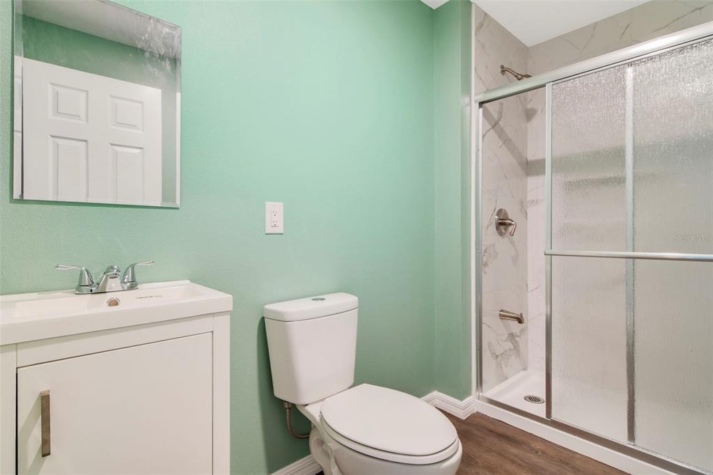 3380 Maple Lane Haines City, FL 33844 - Photo 21 of 28 a bathroom with a toilet sink and shower