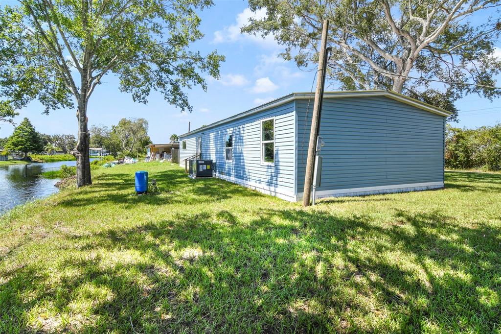 3380 Maple Lane Haines City, FL 33844 - Photo 5 of 28 a view of a backyard with large trees