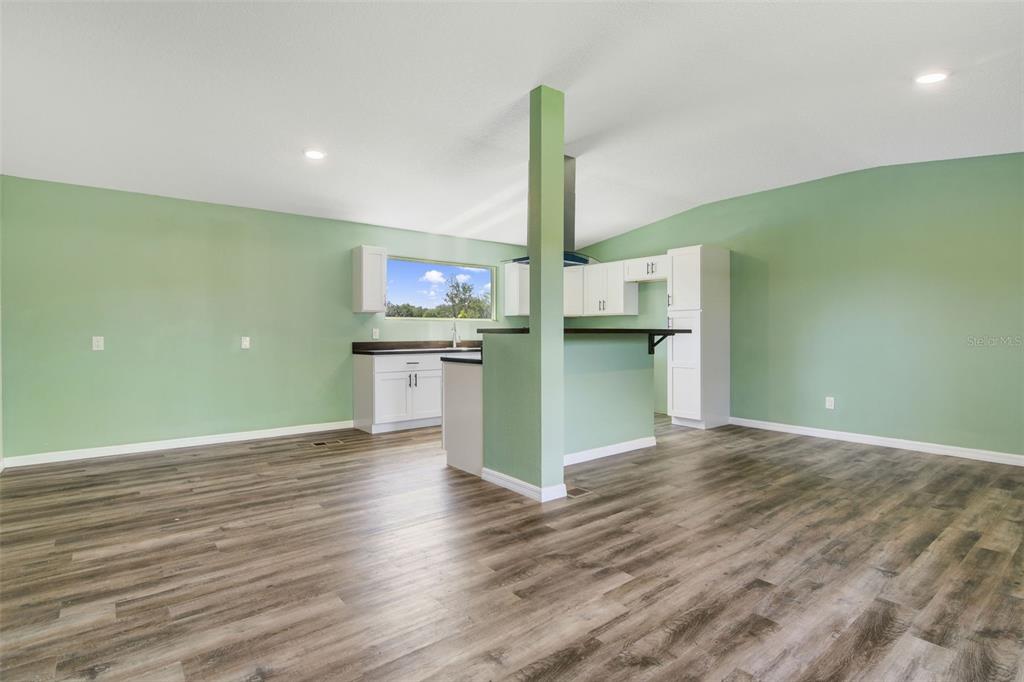 3380 Maple Lane Haines City, FL 33844 - Photo 7 of 28 a view of a kitchen with a sink and a stove top oven