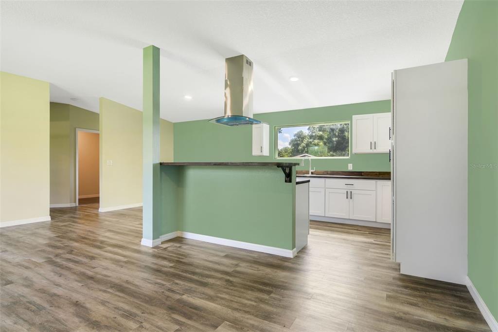 3380 Maple Lane Haines City, FL 33844 - Photo 9 of 28 a kitchen with stainless steel appliances granite countertop a refrigerator and a sink