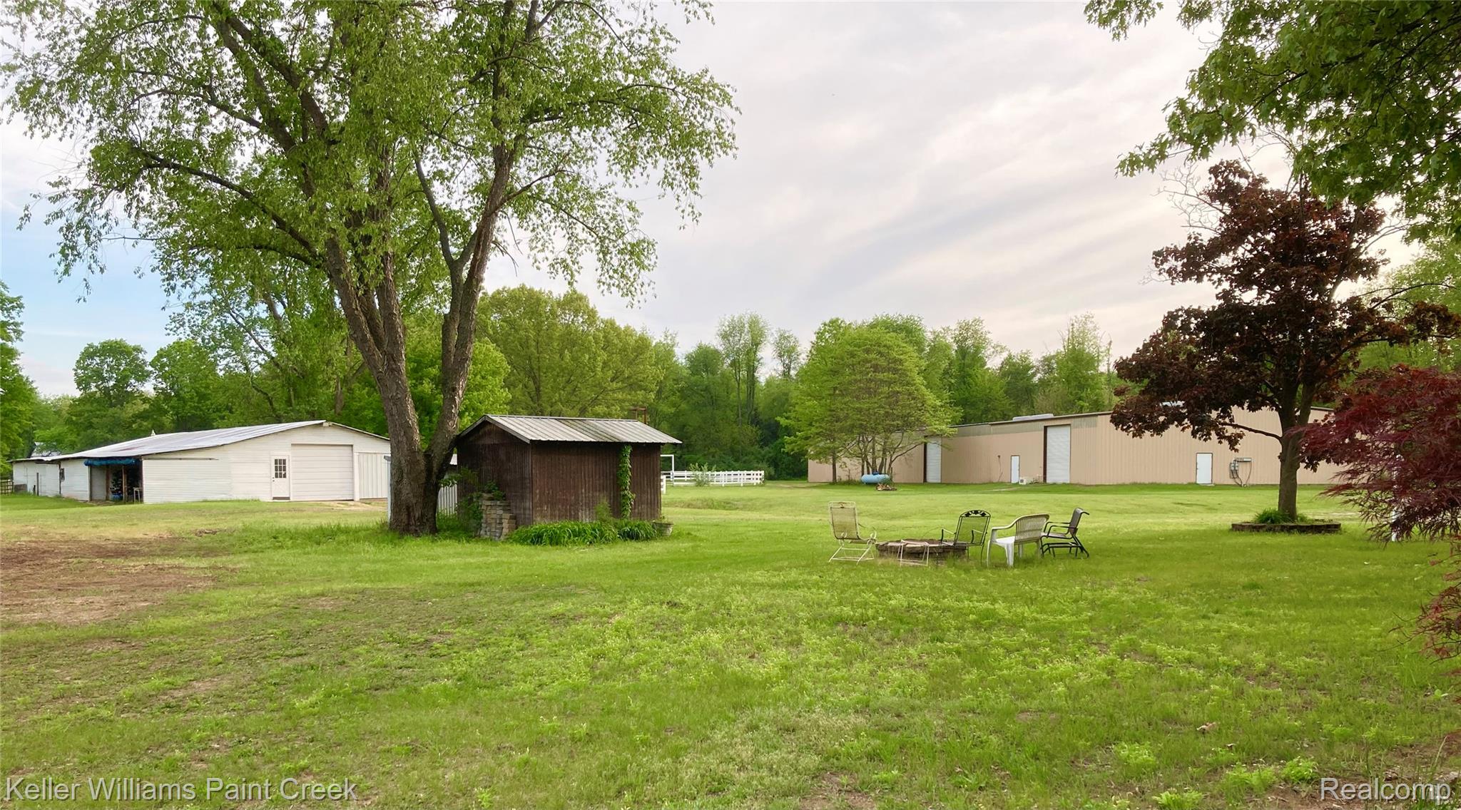 42891 Bemis Road Belleville, MI 48111 - Photo 51 of 51 Stable, indoor arena & sheds. View from the fire pit!