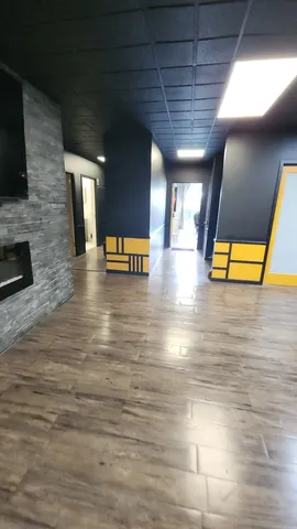 a view of an empty room with a fireplace