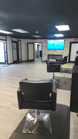 a view of a hallway with a livingroom and an empty space