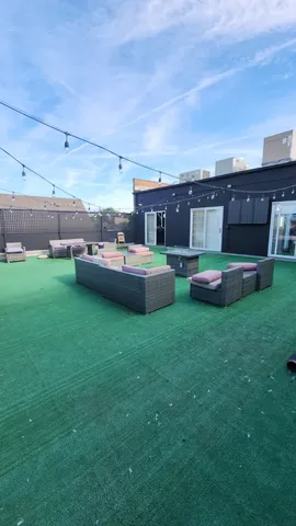 a backyard with table and chairs