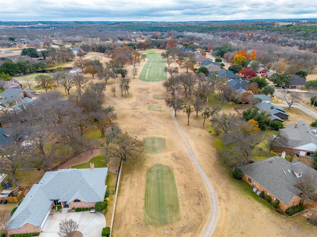 9314 Bellechase Road Granbury, TX 76049 - Photo 13 of 26 an aerial view of residential houses with outdoor space