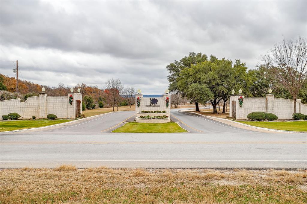 9314 Bellechase Road Granbury, TX 76049 - Photo 15 of 26 a view of a swimming pool with an outdoor space and seating area
