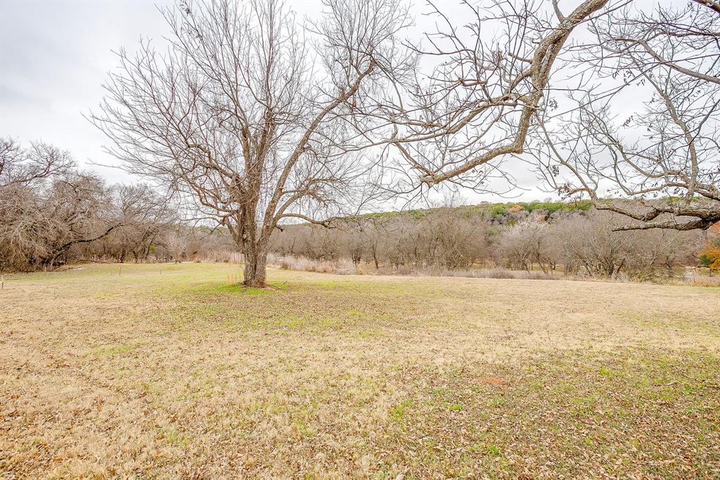 9314 Bellechase Road Granbury, TX 76049 - Photo 17 of 26 a view of an ocean and a trees