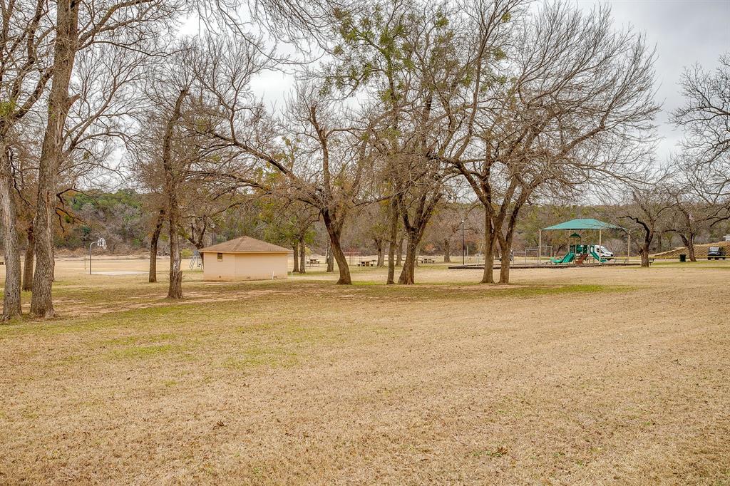 9314 Bellechase Road Granbury, TX 76049 - Photo 25 of 26 a view of large trees with yard