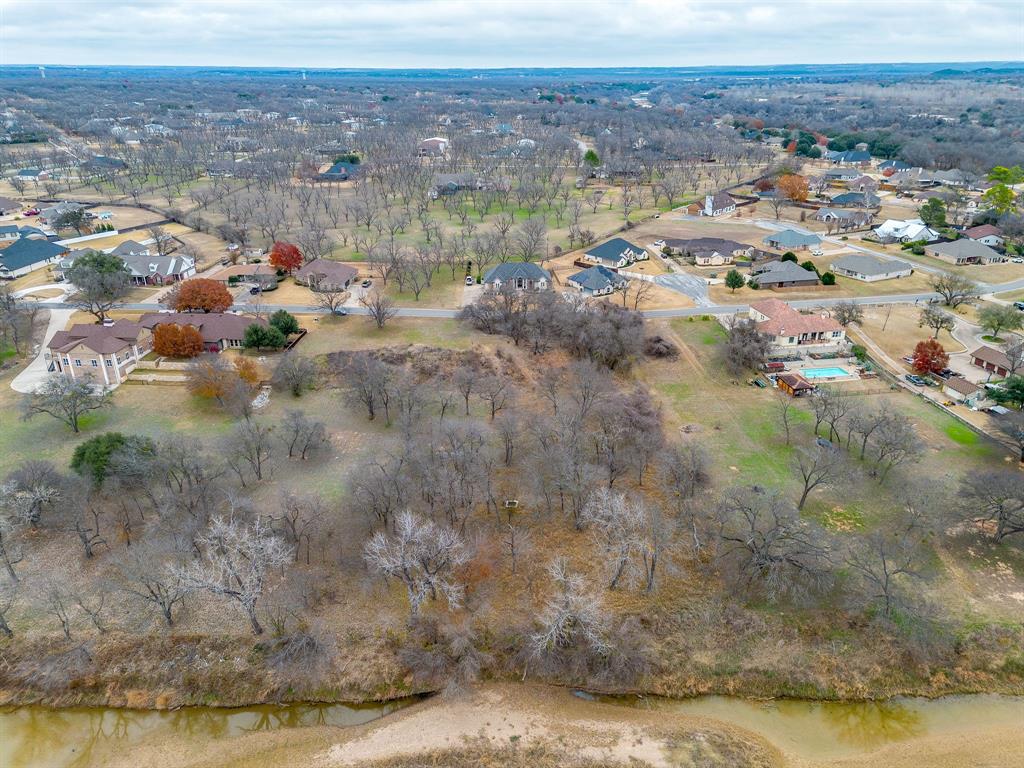 9314 Bellechase Road Granbury, TX 76049 - Photo 7 of 26 a view of a lake with mountains in the background