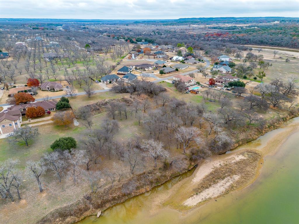 9314 Bellechase Road Granbury, TX 76049 - Photo 8 of 26 a view of a lake with mountains in the background