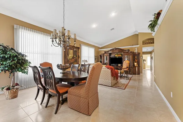 a dining room with furniture and window