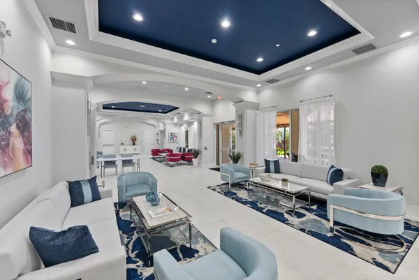 a view of a swimming pool with a table and chairs