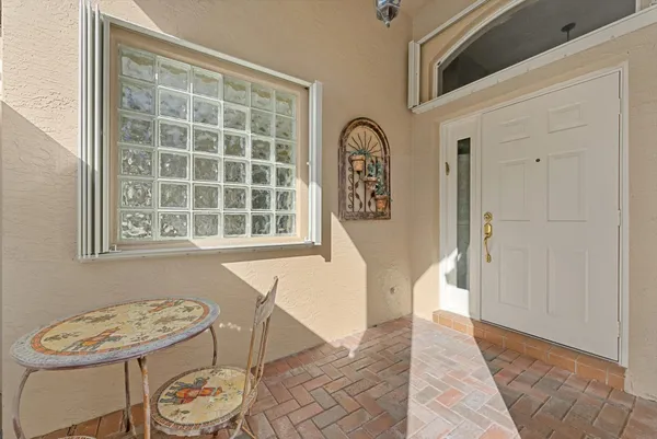 a view of a dining room with furniture and a window
