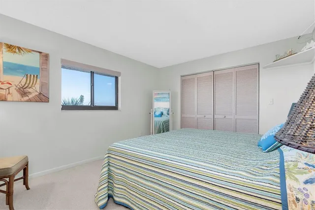 a bedroom with a bed and a lamp