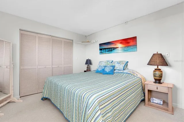 a bathroom with a shower sink vanity mirror and toilet