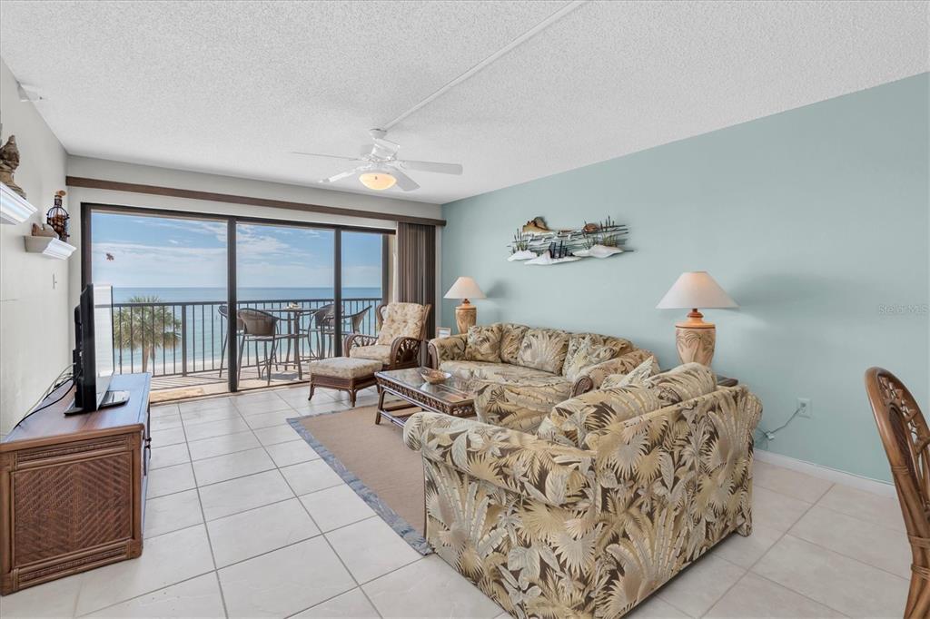 14950 Gulf Boulevard, Unit 402 Madeira Beach, FL 33708 - Photo 2 of 36 a living room with furniture
