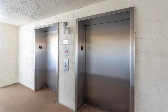 a view of a road with a building in the background