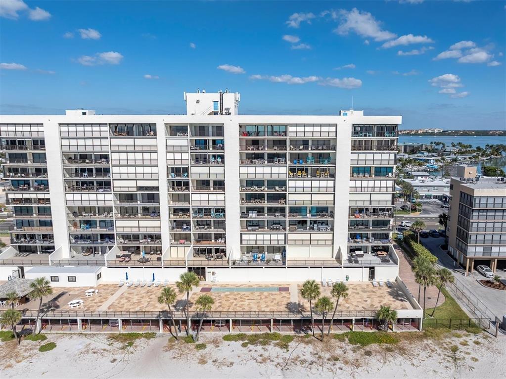 14950 Gulf Boulevard, Unit 402 Madeira Beach, FL 33708 - Photo 35 of 36 a front view of a building with street view