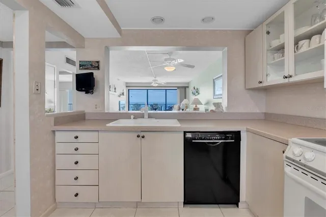 a kitchen with cabinets appliances and a counter space