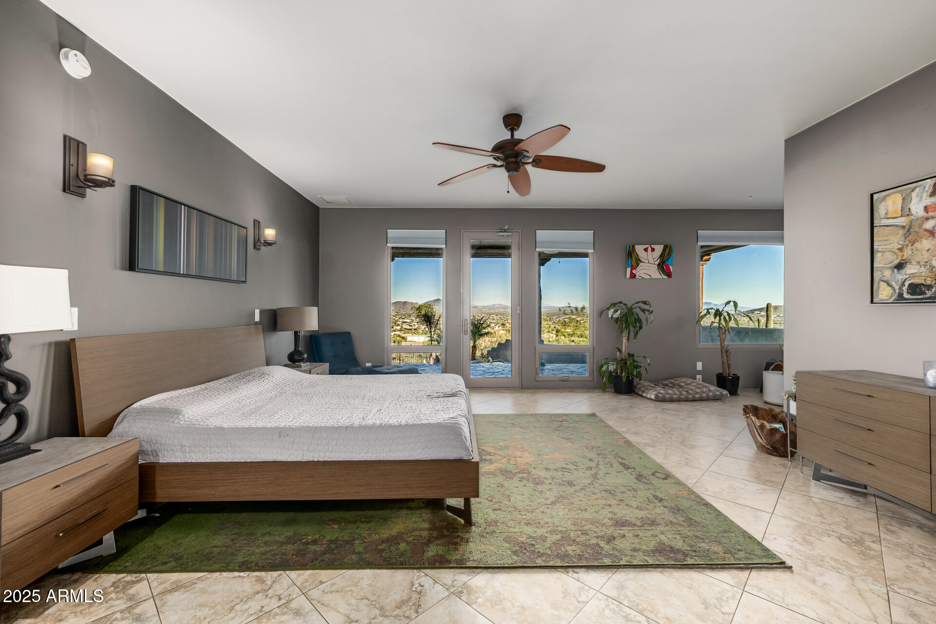 1815 West Sentinel Rock Road Phoenix, AZ 85086 - Photo 21 of 58 a spacious bedroom with a bed a mirror and dresser