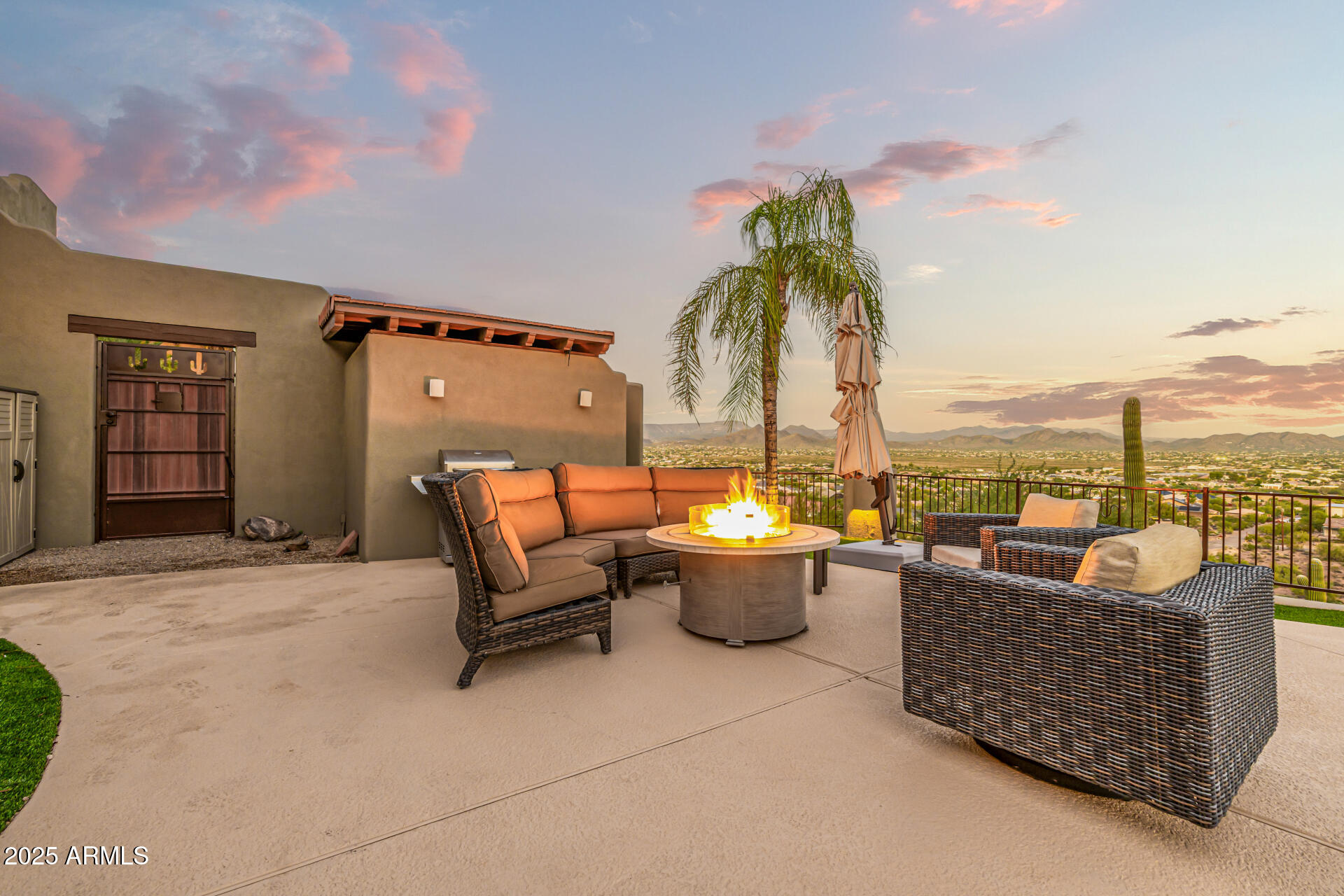 1815 West Sentinel Rock Road Phoenix, AZ 85086 - Photo 50 of 58 a living room with patio furniture and a potted plants