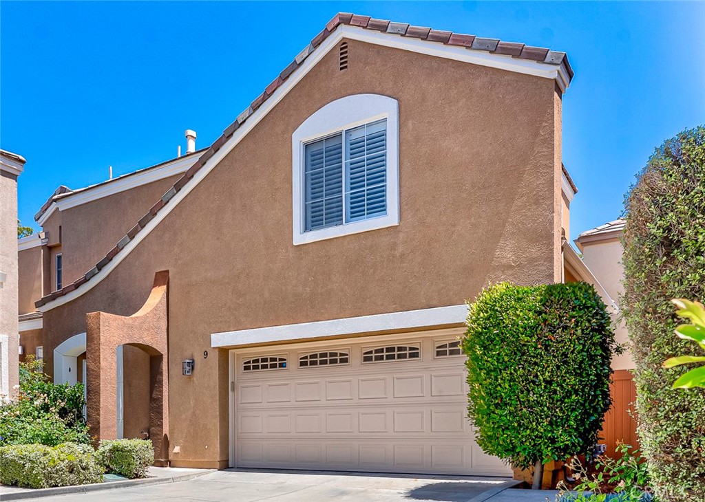 9 Rue Brittany Lake Forest, CA 92610 - Photo 1 of 1 a front view of a house with a yard