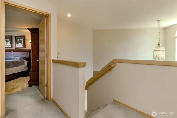 a view of a hallway with a bedroom