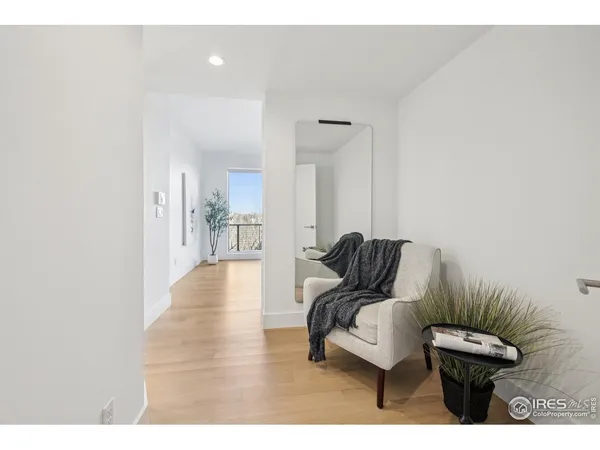 a view of living room filled with furniture and wooden floor