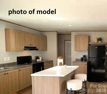 a kitchen with a sink a stove and refrigerator