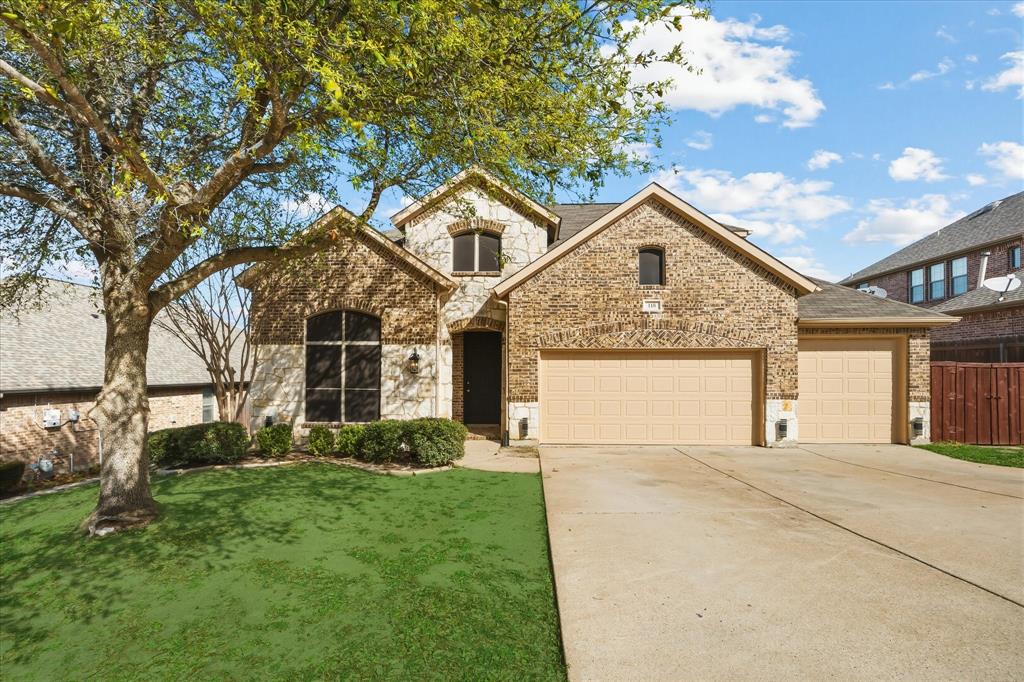118 Stone Drive Forney, TX 75126 - Photo 1 of 26 a front view of a house with a yard and garage