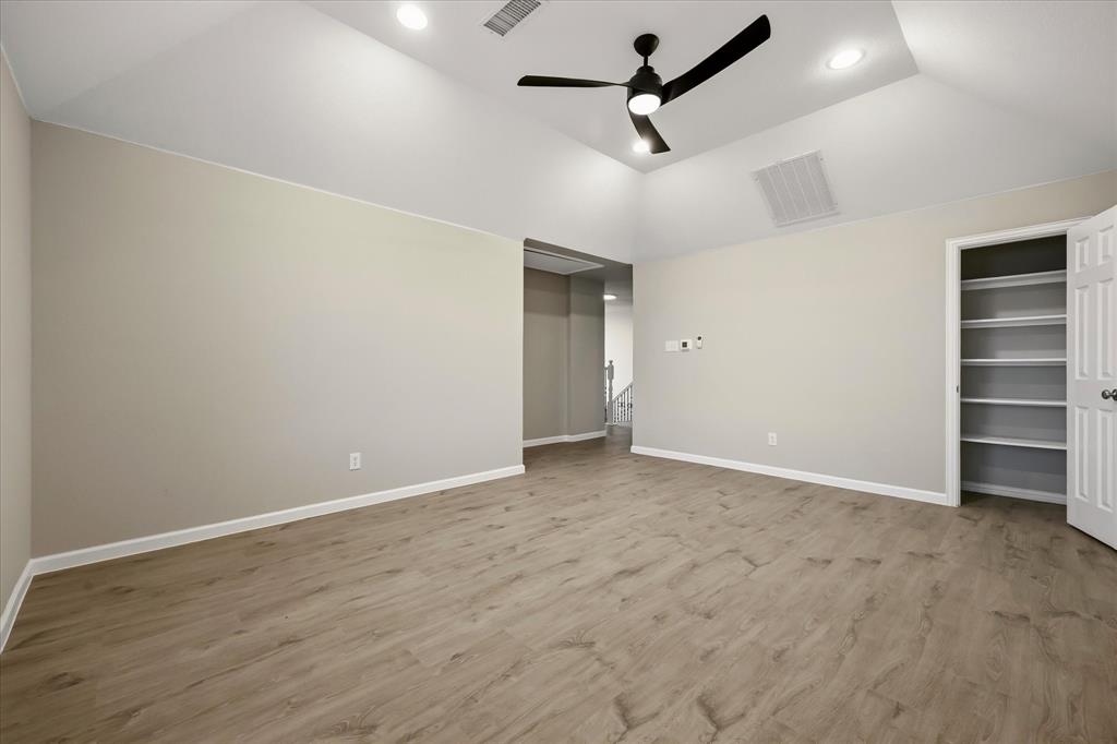 118 Stone Drive Forney, TX 75126 - Photo 18 of 26 an empty room with a ceiling fan and window