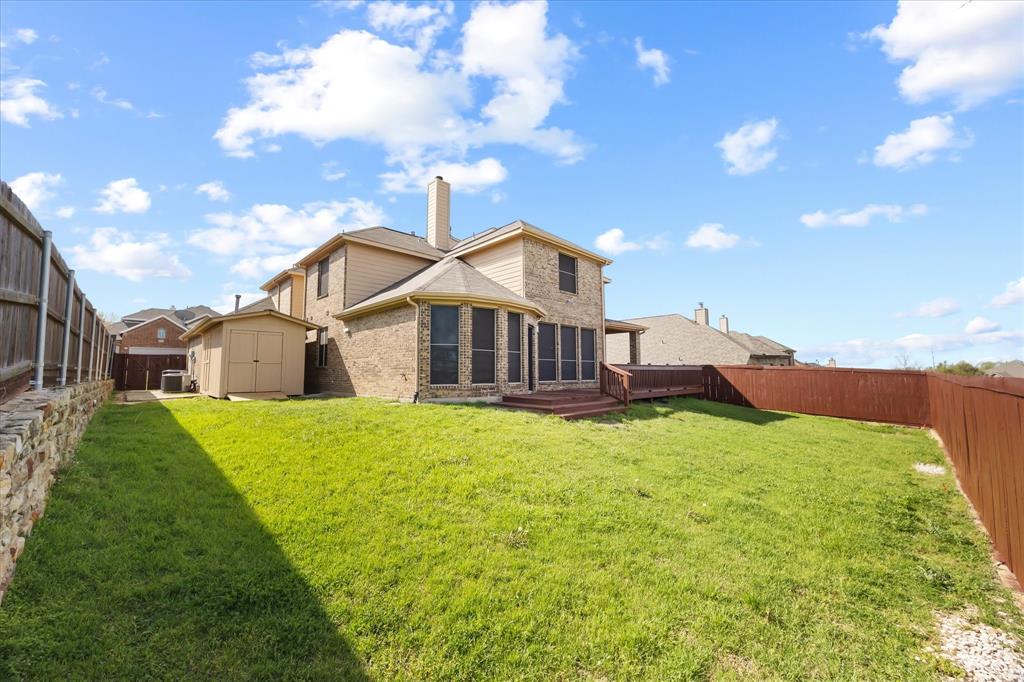 118 Stone Drive Forney, TX 75126 - Photo 2 of 26 a front view of a house with a yard and garage