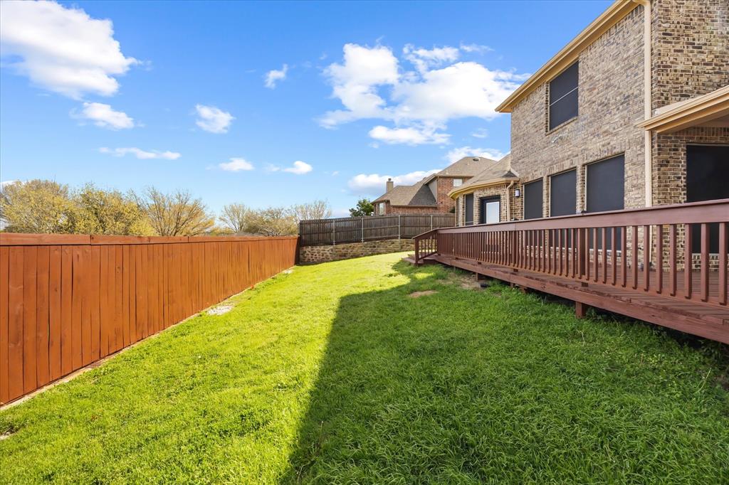 118 Stone Drive Forney, TX 75126 - Photo 25 of 26 a view of a garden with a house