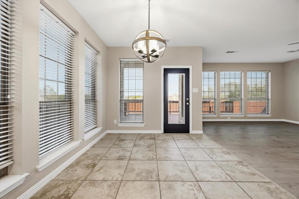 118 Stone Drive Forney, TX 75126 - Photo 9 of 26 a view of an empty room with a window