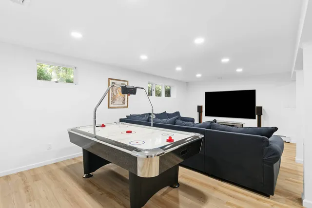 a living room with furniture and flat screen tv