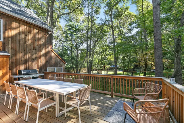 a view of a patio with a table chairs and a table