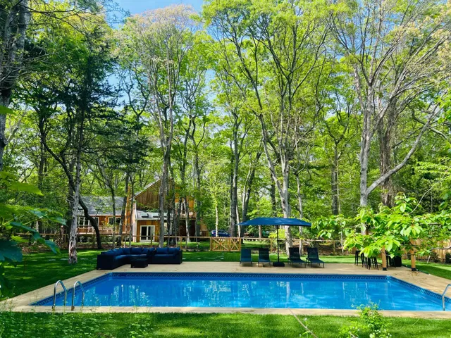 a view of a park with large trees