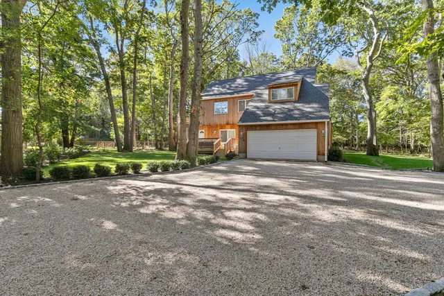 a view of a park that has large trees