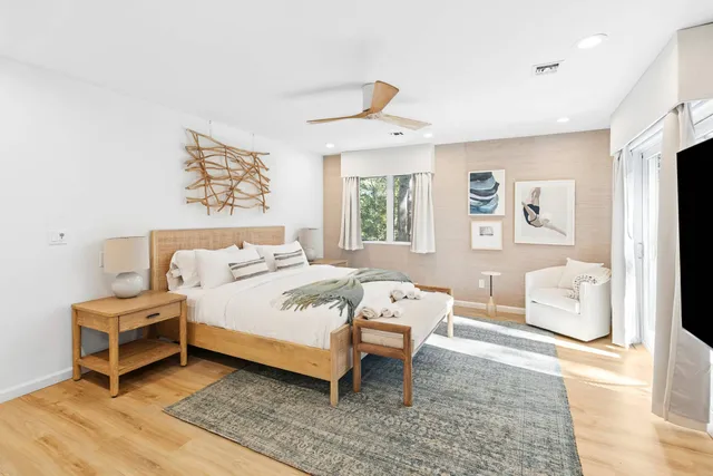 a bed room with a bed and a chair