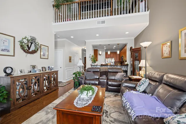 a bedroom with double bed and a large window