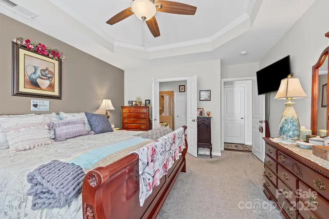 a en suite bathroom with double vanity and a mirror
