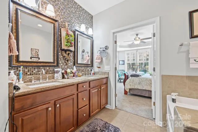 a utility room with stainless steel appliances granite countertop a washer and dryer