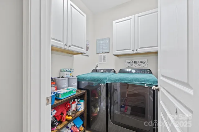a view of a workspace with furniture and a potted plant