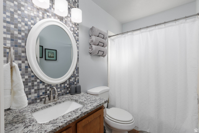 161 West 950 South, Unit S4 St. George, UT 84770 - Photo 11 of 21 Full bathroom featuring tasteful backsplash, vanity, and a shower with curtain