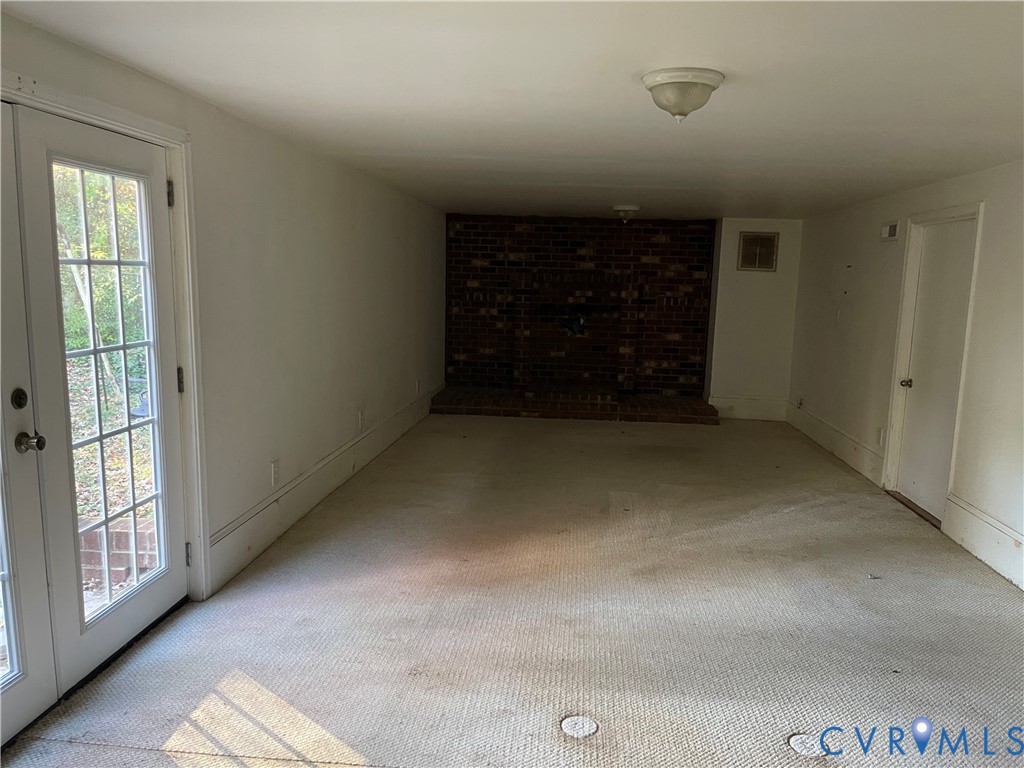2118 Dolin Street Hopewell, VA 23860 - Photo 14 of 17 Carpeted spare room featuring french doors