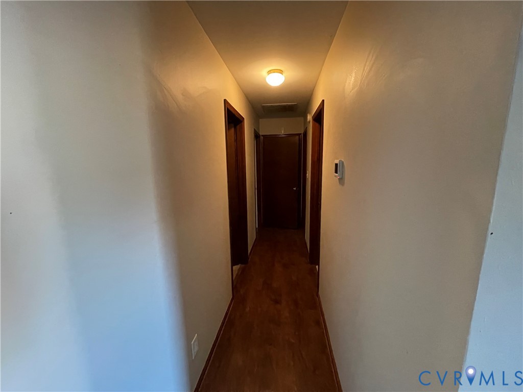 2118 Dolin Street Hopewell, VA 23860 - Photo 10 of 17 Hall with baseboards and dark wood finished floors